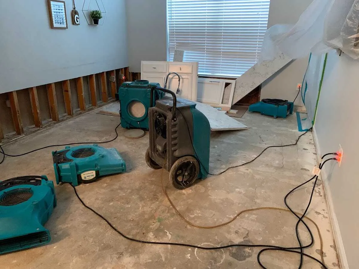 Dehumidifier in flood-cut room for Water Damage Restoration in Alton